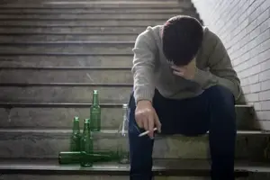 depositphotos_183194188-stock-photo-depressed-man-underground-beer-cigarette.webp