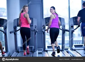 depositphotos_338032666-stock-photo-group-young-people-running-treadmills.webp