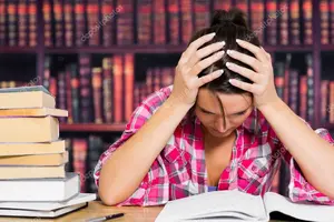 depositphotos_24109797-stock-photo-stressed-student-in-library.webp