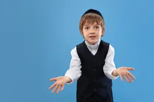 portrait-of-a-young-orthodox-jewish-boy-isolated-on-blue-studio_155003-9121.webp