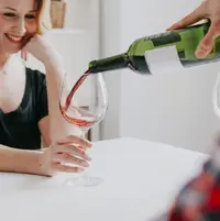 man-pouring-wine-for-girlfriend_23-2147770767.webp