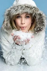 depositphotos_2294867-stock-photo-woman-blowing-snow.webp