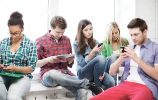 depositphotos_42905901-stock-photo-students-looking-into-devices-at.webp