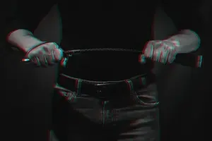 handsome-guy-with-a-bdsm-whip-in-his-hands_137321-170.webp