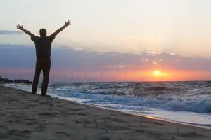 man-welcomes-sunrise-beach-raised-his-hands-gleefully-toward-rising-sun-sea-56430787.webp