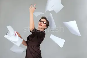 3115334_stock-photo-woman-throwing-paper-pages.webp