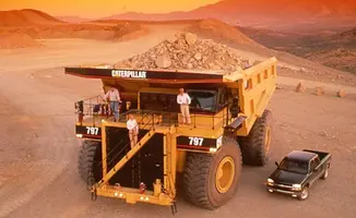 Caterpillar-797-dump-truck-876x539.webp