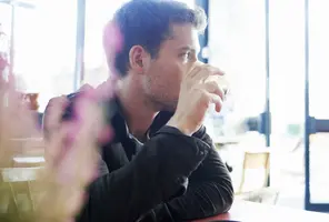 o-MAN-DRINKING-COFFEE-facebook.webp